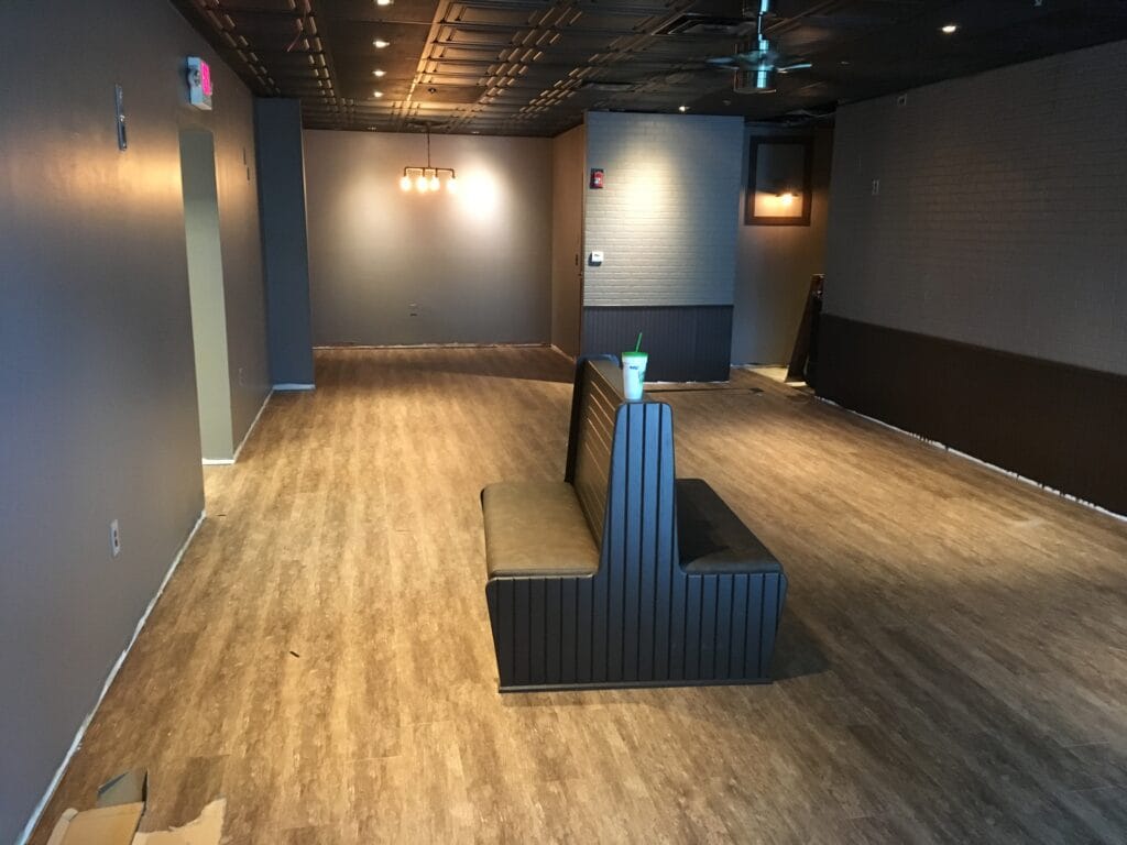 Wood-look vinyl plank flooring in a restaurant dining area