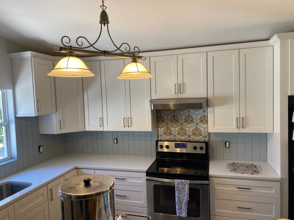 White kitchen with gray tile backsplash
