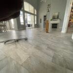 Gray large-format tile flooring in a living room