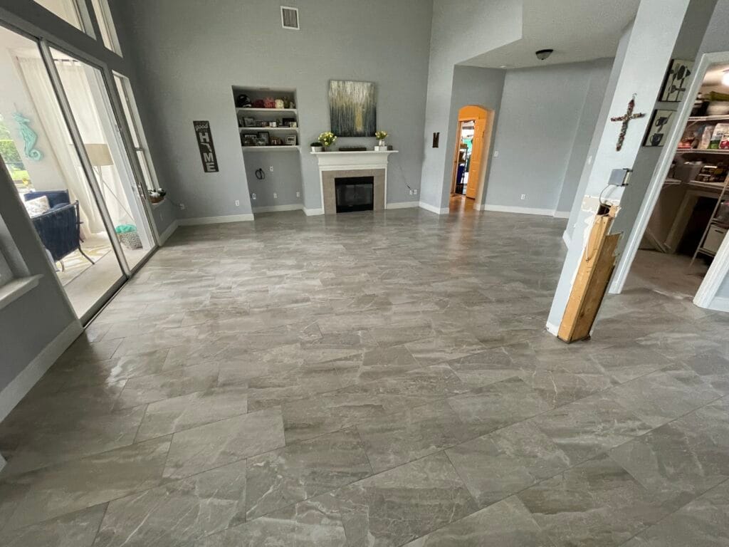 Gray marble-look tile in a living room with fireplace